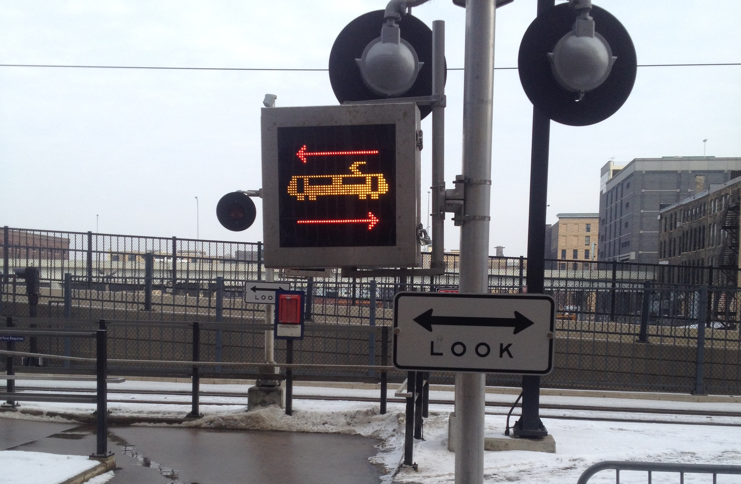 Look signs at rail crossing